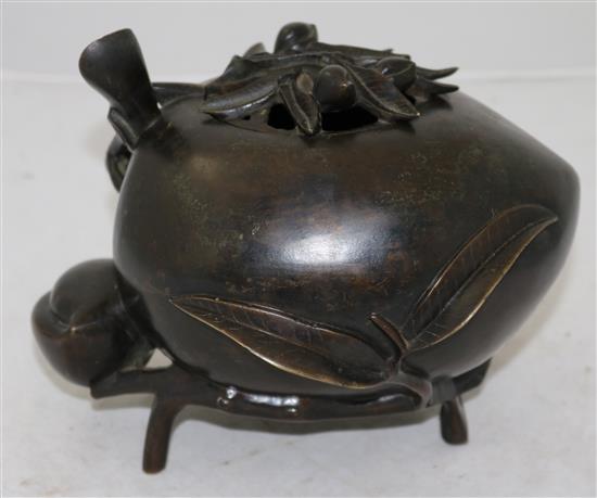 A large Chinese bronze peach-shaped censer and cover, 17th/18th century, height 17.5cm, length 21cm